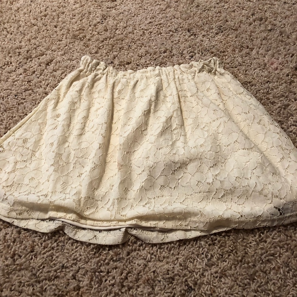 A laced cream colored skirt